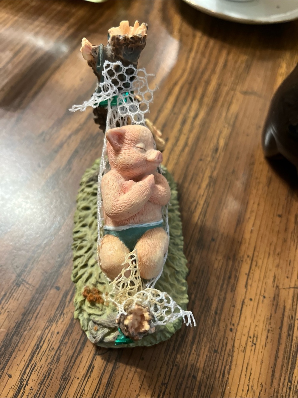 Source Unknown Pink Piglet Hammock Figurine with Green Accent